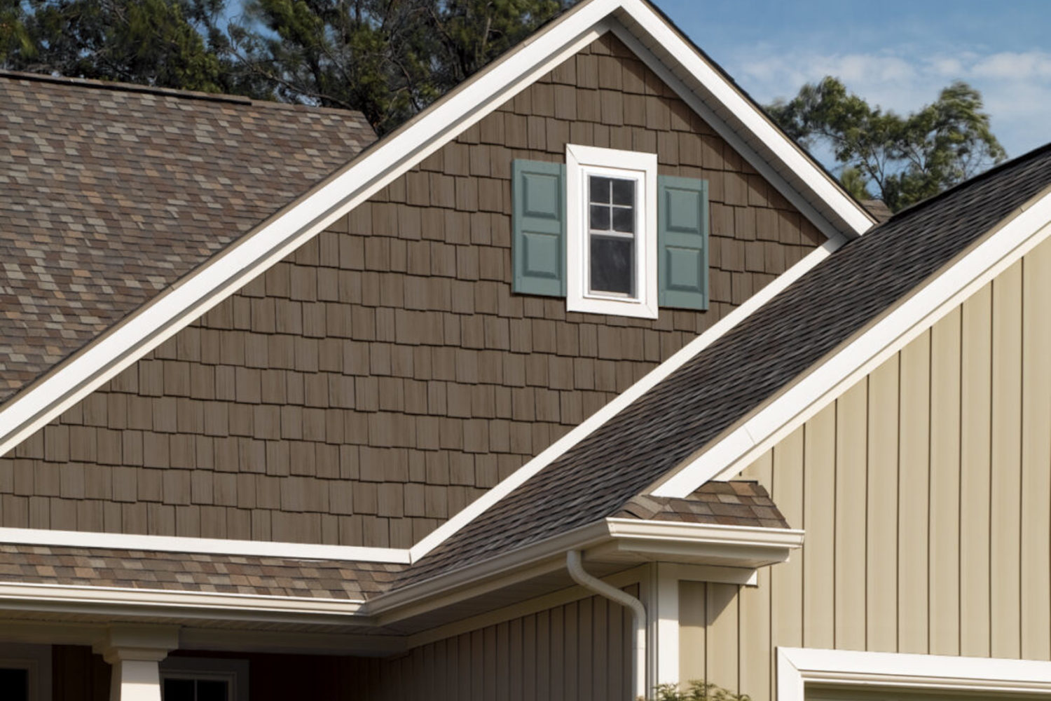 Modern house with vinyl siding showing both shake and board and batten styles